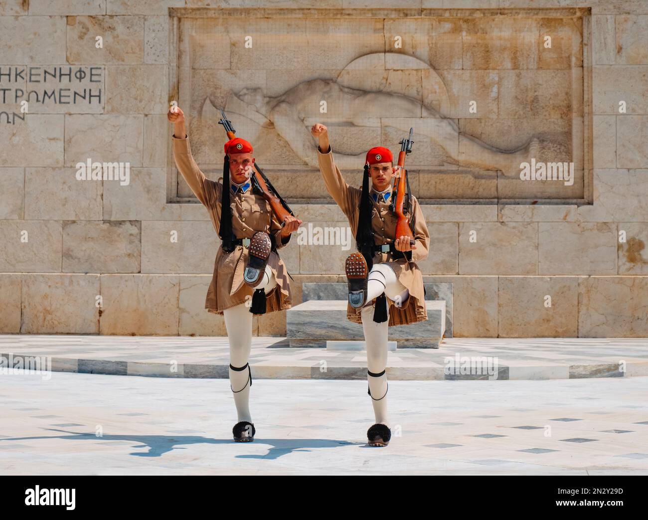 Athens, Greece - August 30, 2022: A moment of the changing of the guard at the Tomb of the Unknown Soldier in Athens, Greece, when the two Evzones mar Stock Photo
