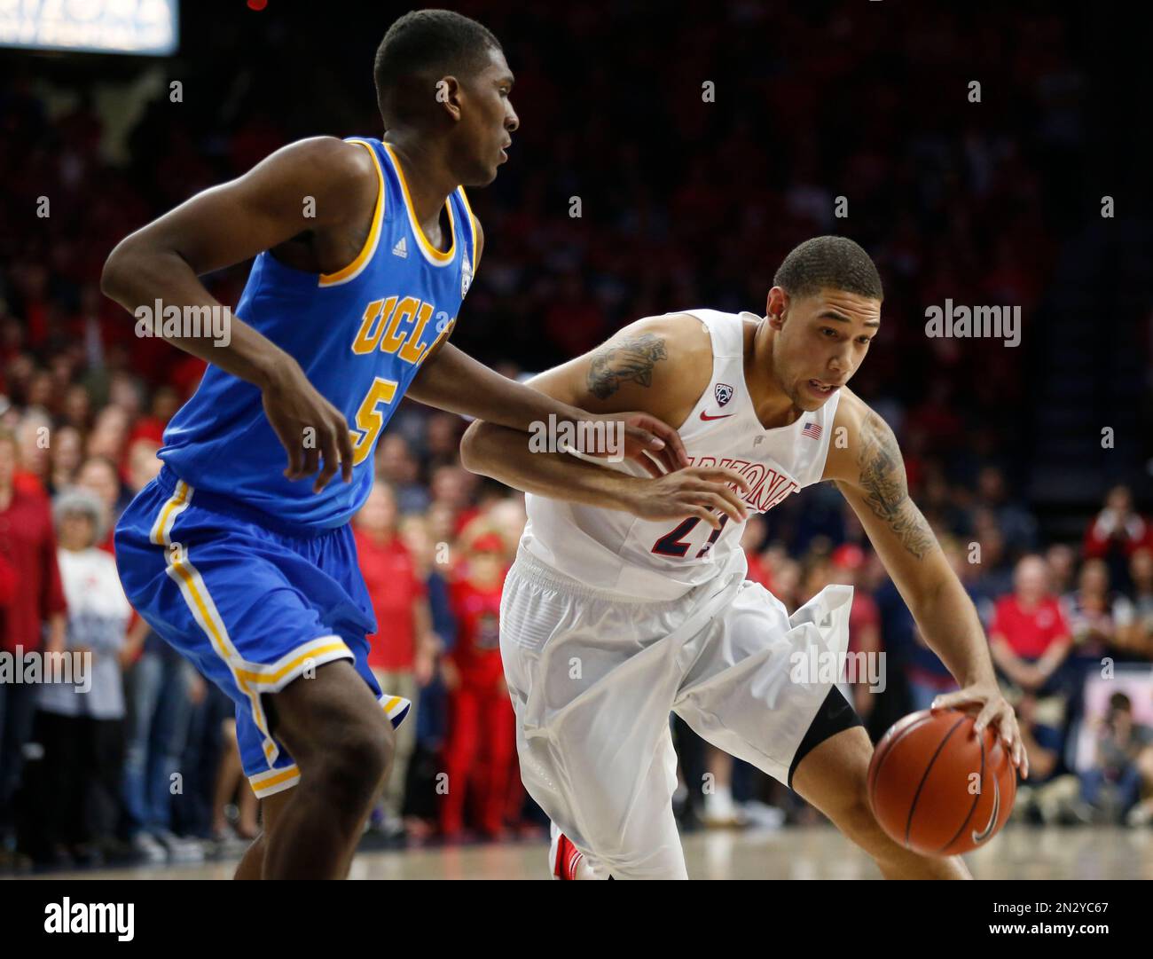 Arizona forward Brandon Ashley (21) drives on UCLA forward Kevon Looney