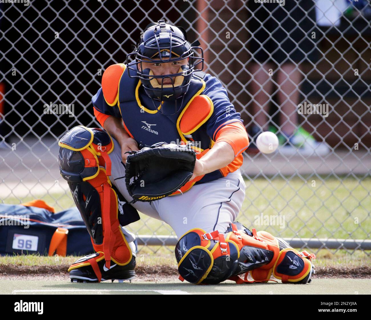 Houston Astros catcher Hank Conger catches a throw during a spring training baseball workout