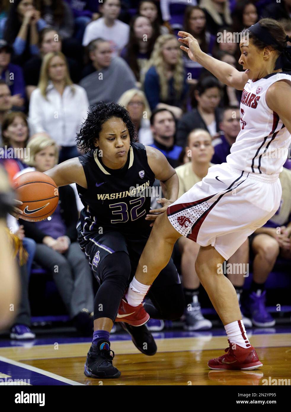 Washington's Jazmine Davis, left, is fouled by Washington State's Tia