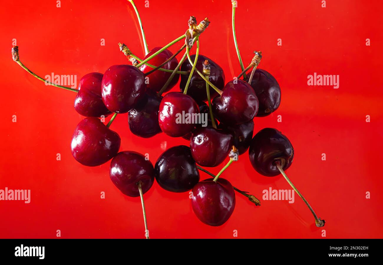 Ripe cherries on a solid background, healthy vegetarian food. Beautiful ...