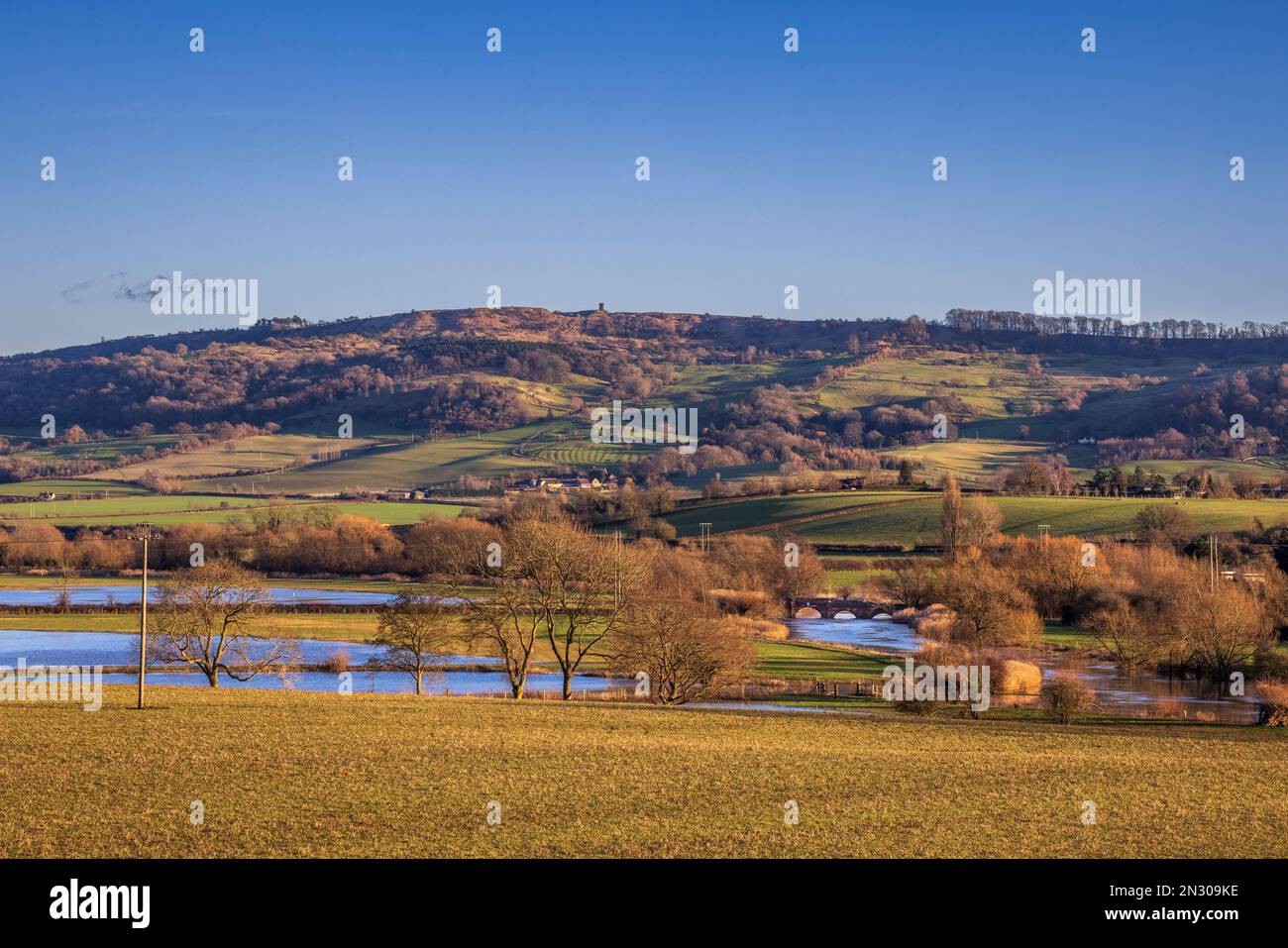 Bredon Hill Tower and Eckington Bridge over the River Avon in the