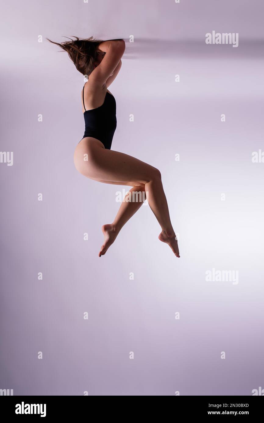 Studio shot of attractive little gymnast girl of wearing black