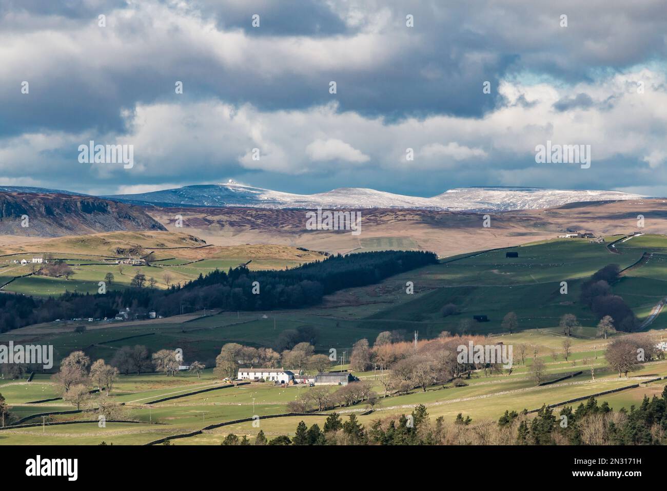 Three Pennine Peaks. Left to right, snow capped Great Dun Fell with radar station, Little Dun Fell and Cross Fell. Stock Photo