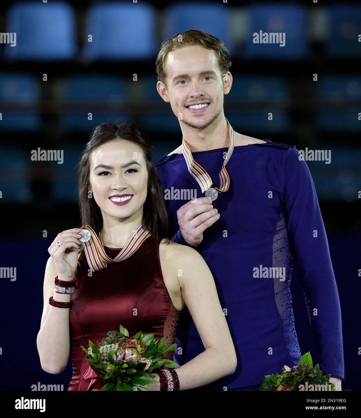 Madison Chock and Evan Bates of the United States pose with silver