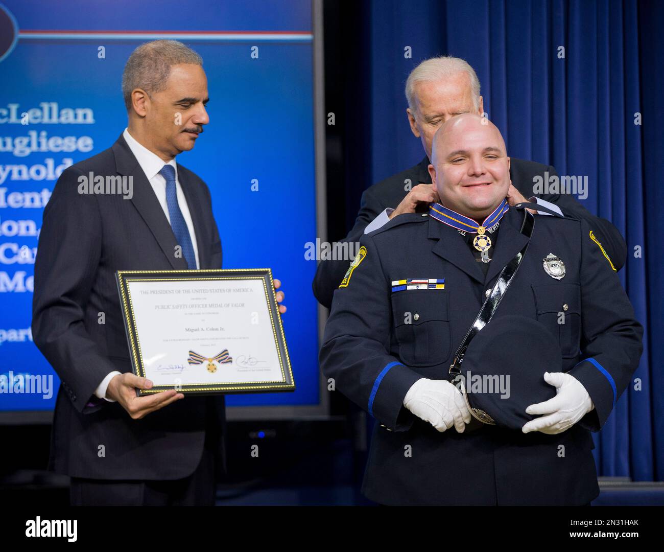 Attorney General Eric Holder and Vice President Joe Biden award the