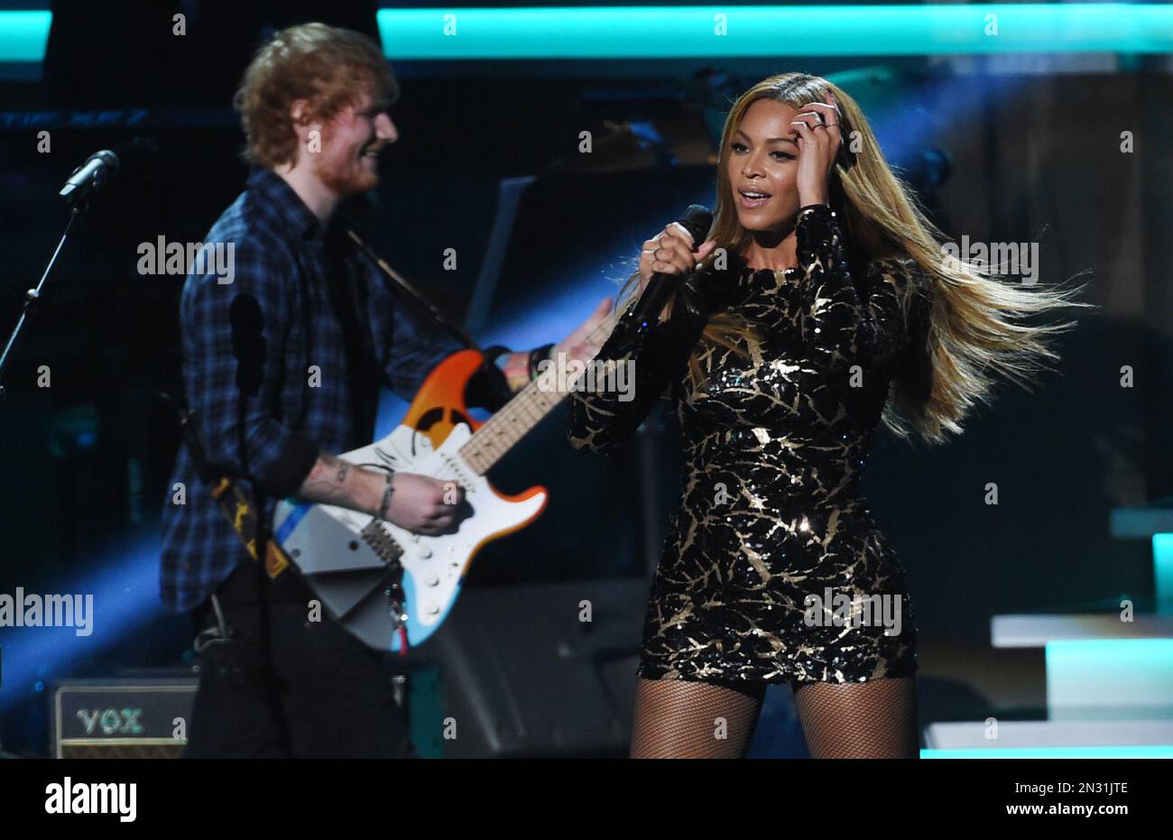 Beyonce, right, performs with Ed Sheeran at
