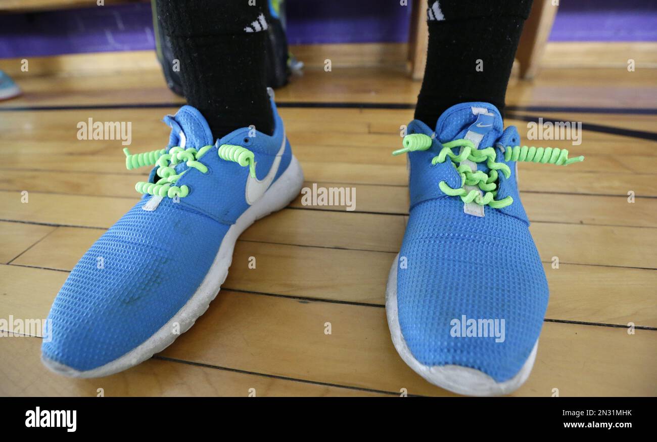 A student shows off "Y-Ties" no tie shoelaces that are sold as a fund  raider at James Bowie Elementary in Dallas. Friday, Jan. 30, 2015. Many  states have decided that school fundraisers