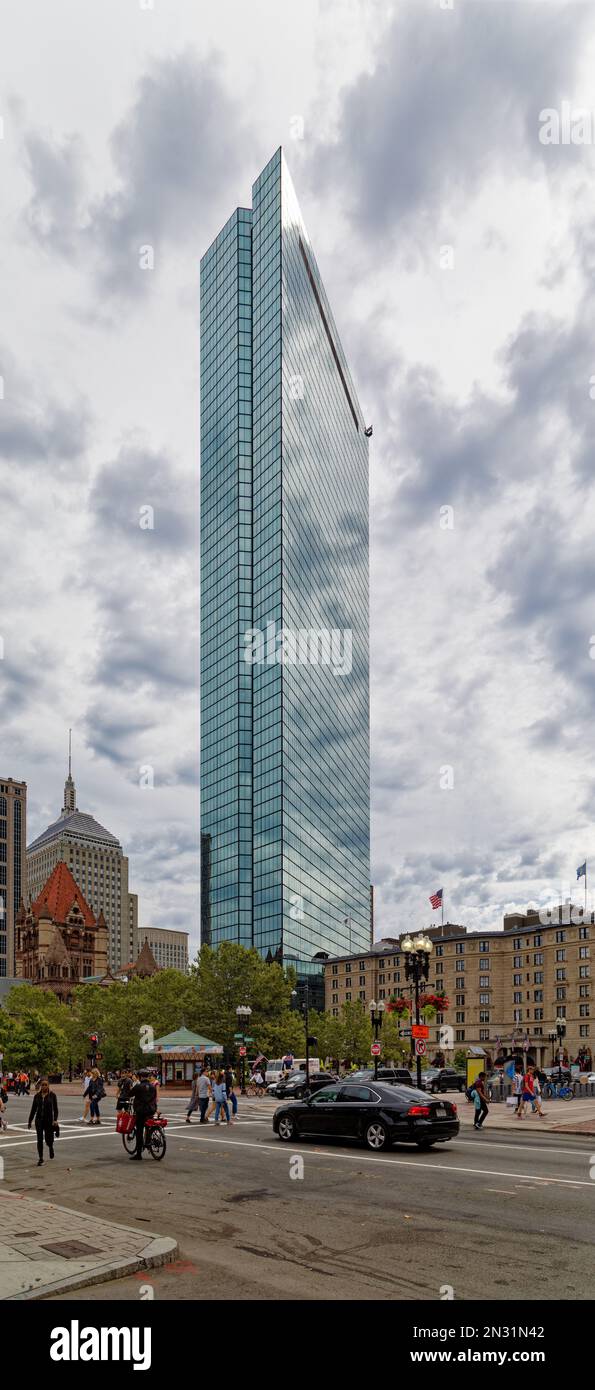 Boston Back Bay: 200 Clarendon Street, is the iconic former John Hancock Tower, a blue-tinted glass monolith that reflects the sky and all around it. Stock Photo