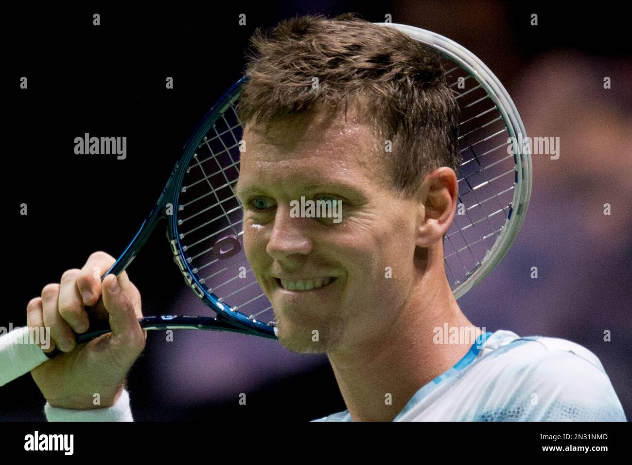 Tomas Berdych of the Czech Republic is amused by a call of one of the  linesman as he plays Germany's Tobias Kamke during their first round match  of the 42nd ABN AMRO