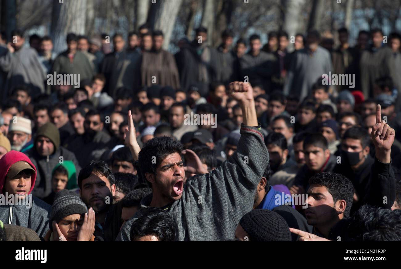 A Kashmiri villager shouts freedom slogans during the funeral ...