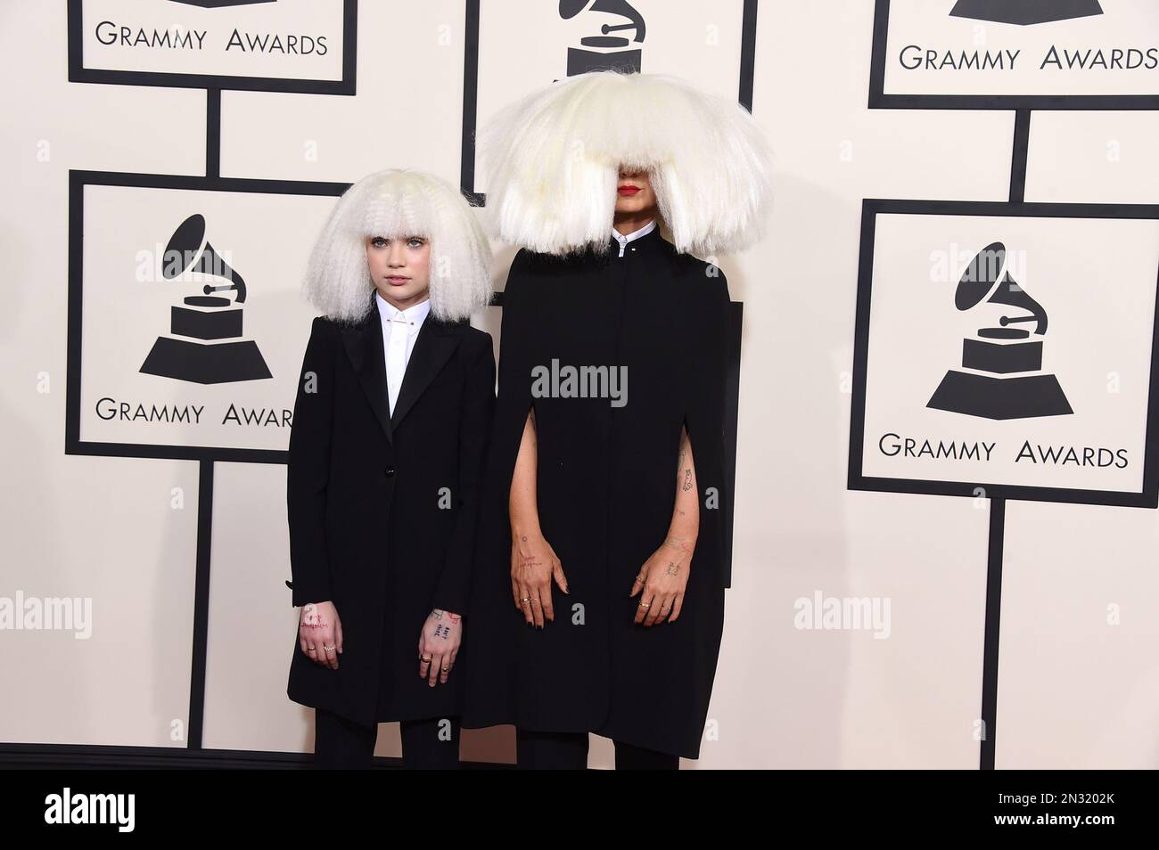 Sia, right, and Maddie Ziegler arrive at the 57th annual Grammy Awards