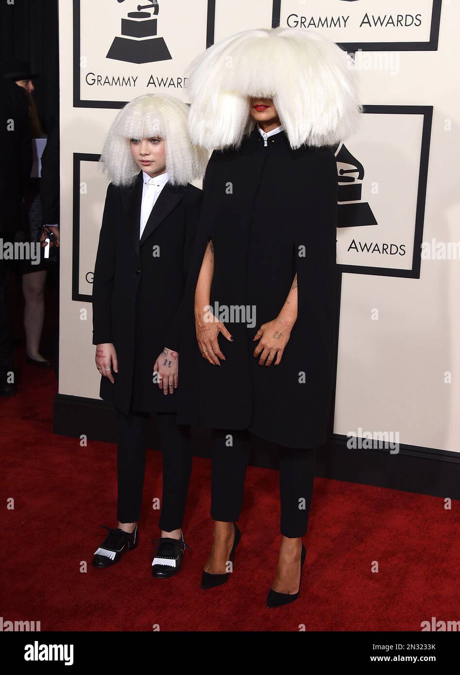 Sia, right, and Maddie Ziegler arrive at the 57th annual Grammy Awards