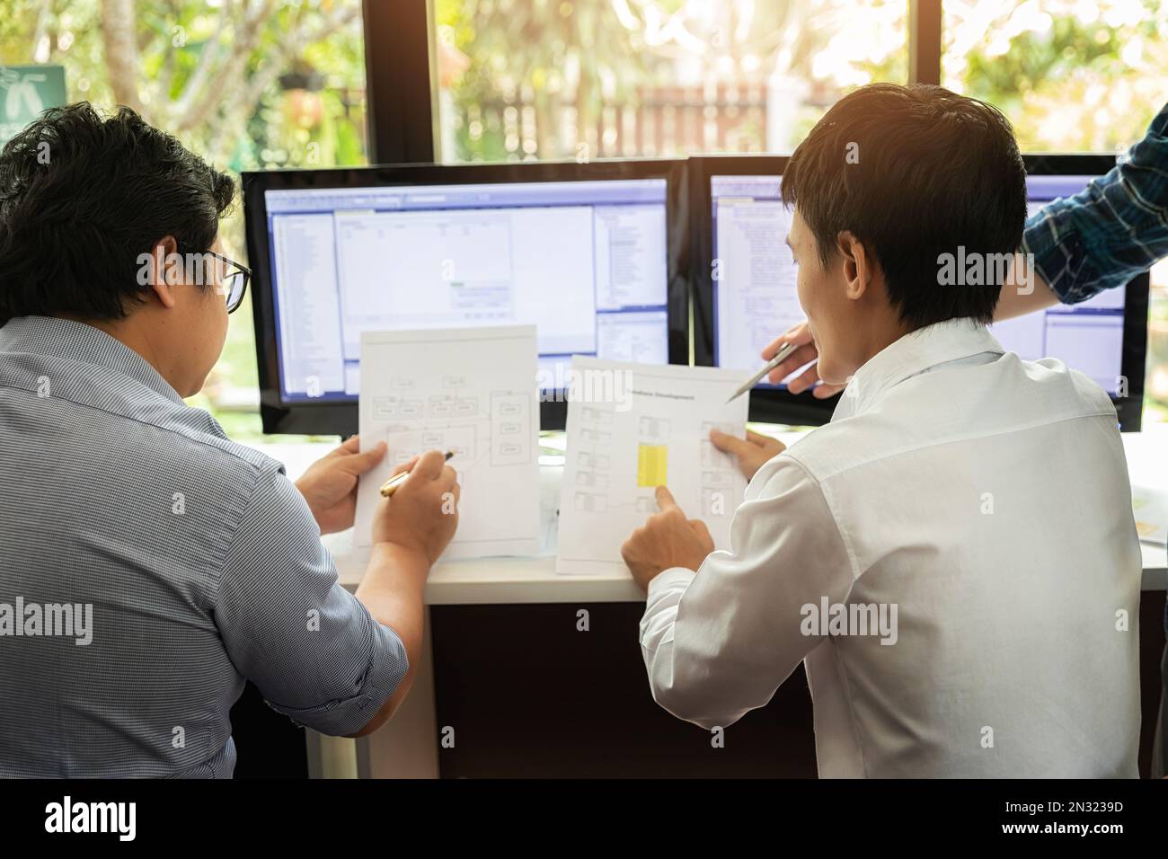 Programmers team working in a software developing. Developing programming and coding technologies. Website design. Cyber space concept. Stock Photo