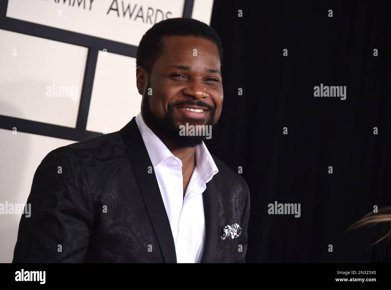 Pamela Warner, left, and Malcolm-Jamal Warner arrive at the 57th annual