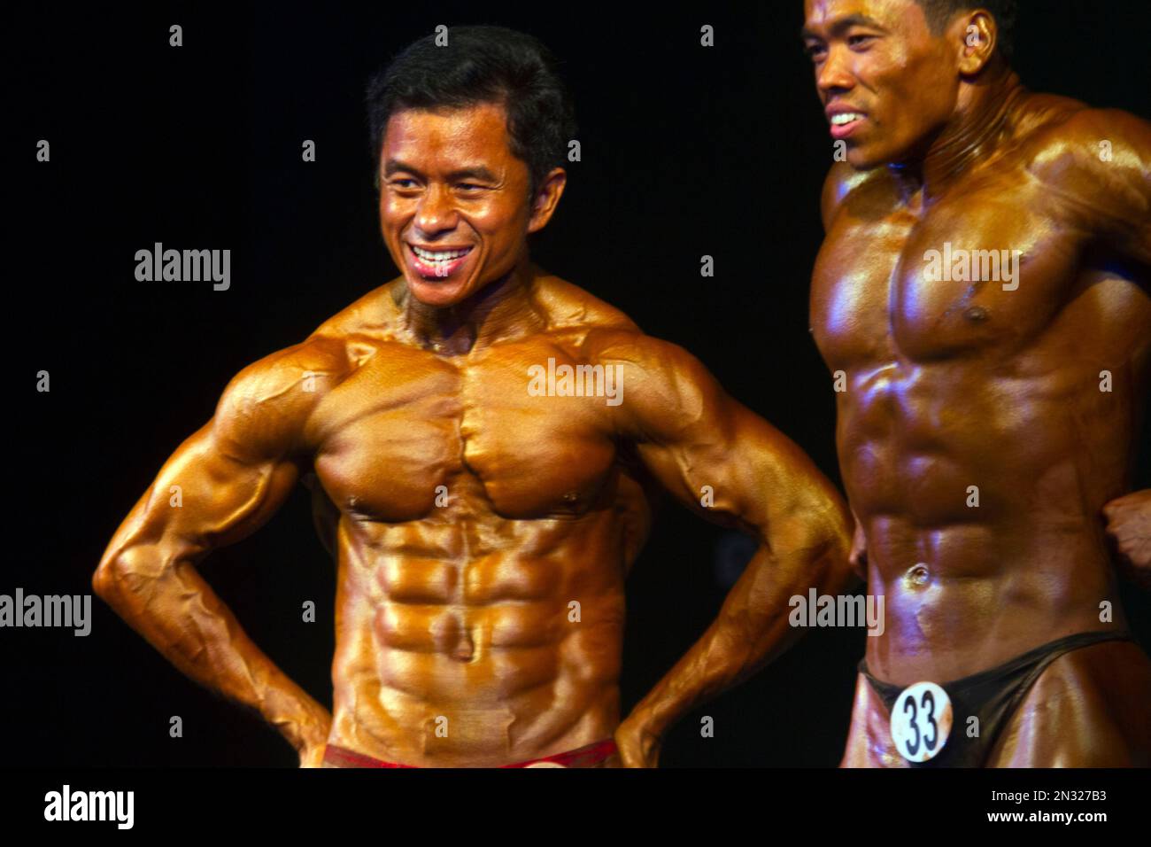 A bodybuilder competes during the bodybuilding contest organized by