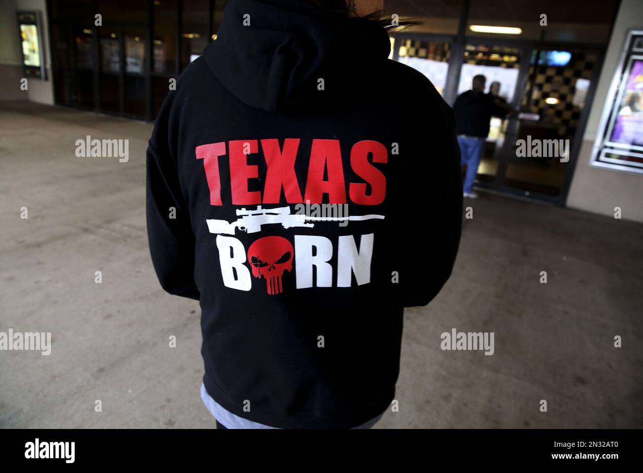 In this Thursday, Jan. 22, 2015 photo, a woman wears a Chris Kyle