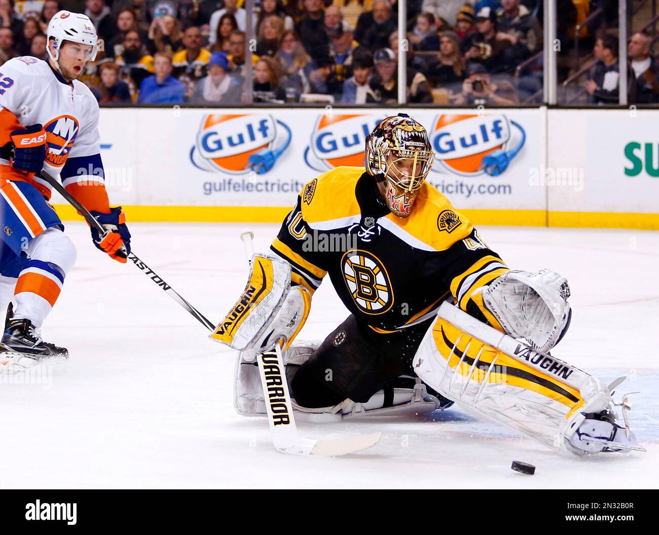 Boston Bruins goalie Tuukka Rask makes a save as New York Islanders ...