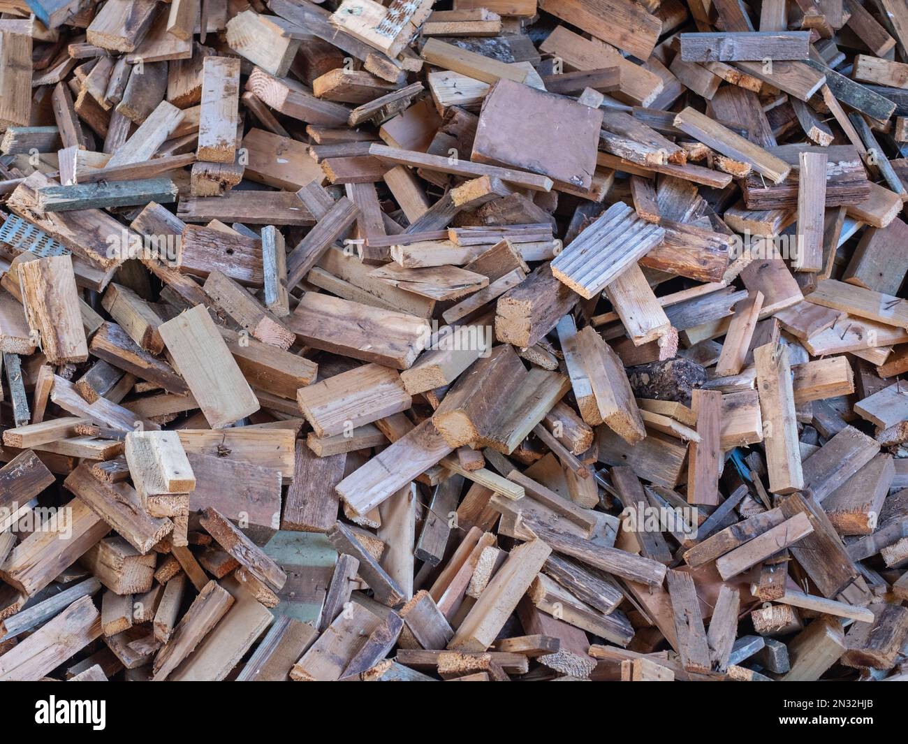 Pattern formed by a heap of sawn wood and chopping remains for use as fuel Stock Photo