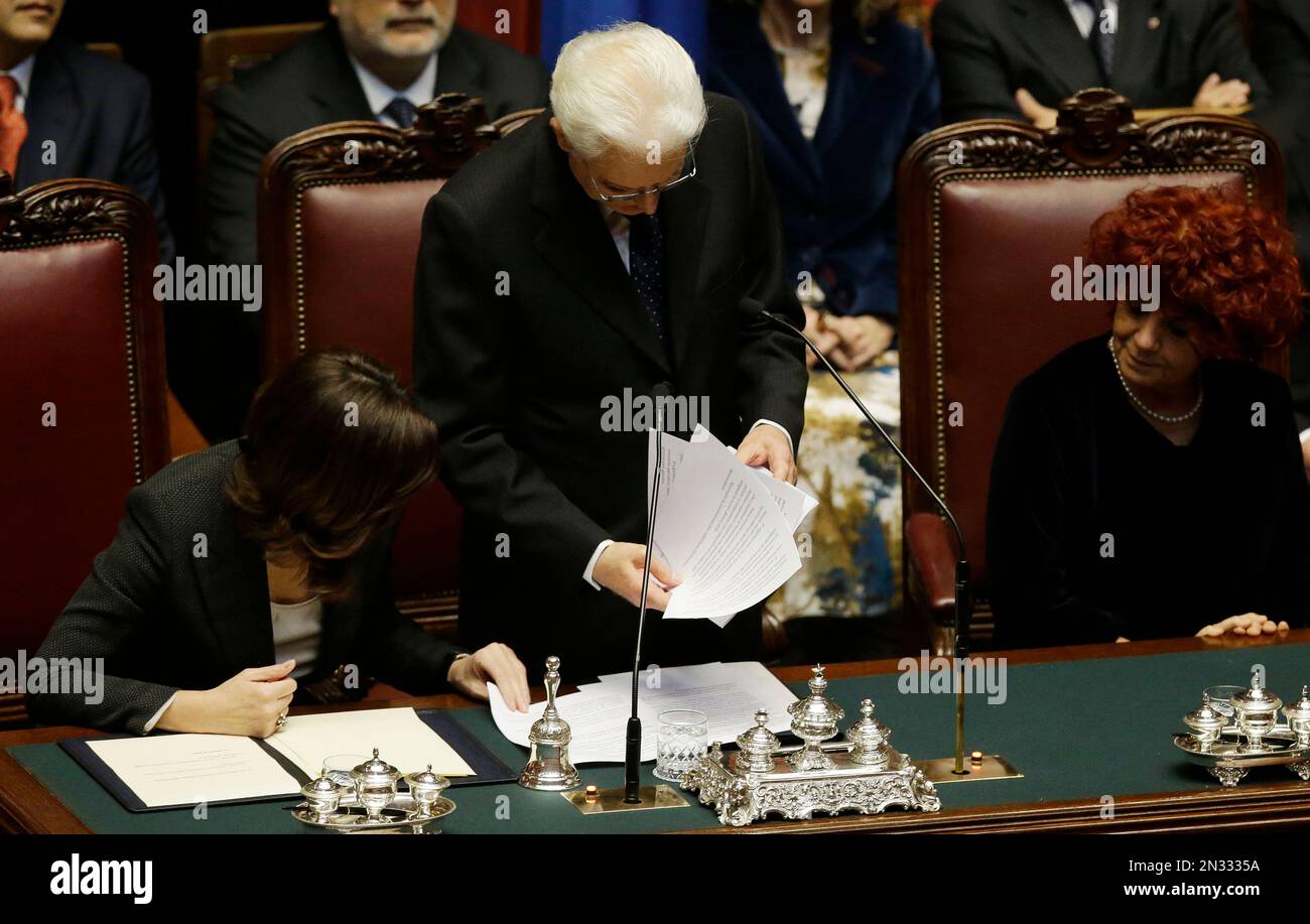 Newly elected Italian President Sergio Mattarella, center, flanked by Lower Chamber President Laura Boldrini, left, and vice-president of Italian Senate Valeria Fedeli, right, delivers his speech during his swearing-in ceremony at the Lower Chamber in Rome, Tuesday, Feb. 3, 2015. Sergio Mattarella on Monday resigned from his post as constitutional judge, a day before his swearing-in ceremony. Mattarella, 73, was elected as the new president on Saturday, in the fourth round of balloting held by Italian parliament in joint session. (AP Photo/Gregorio Borgia) Stock Photo