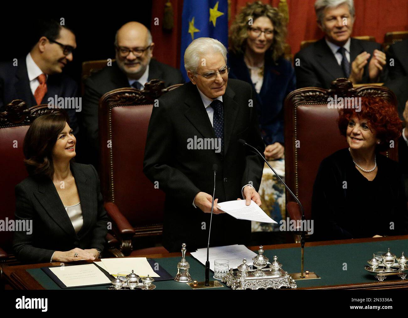 Newly elected Italian President Sergio Mattarella, center, flanked by Lower Chamber President Laura Boldrini, left, and vice-president of Italian Senate Valeria Fedeli, right, delivers his speech during his swearing-in ceremony at the Lower Chamber in Rome, Tuesday, Feb. 3, 2015. Sergio Mattarella on Monday resigned from his post as constitutional judge, a day before his swearing-in ceremony. Mattarella, 73, was elected as the new president on Saturday, in the fourth round of balloting held by Italian parliament in joint session. (AP Photo/Gregorio Borgia) Stock Photo