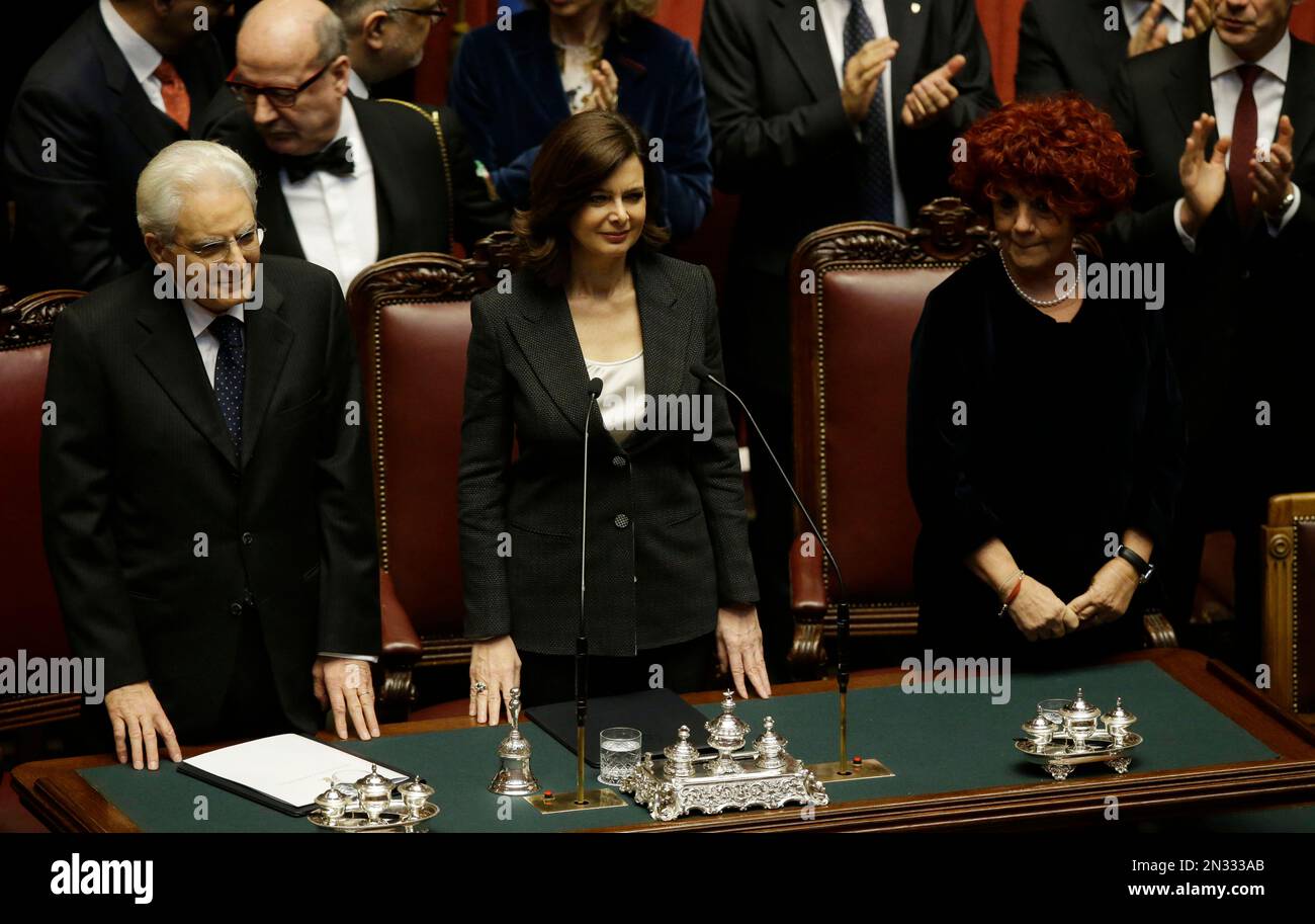 Newly elected Italian President Sergio Mattarella, left, flanked by Lower Chamber president Laura Boldrini, center, and vice-president of Italian Senate Valeria Fedeli, right, arrives prior to the start of his swearing-in ceremony at the Lower Chamber in Rome, Tuesday, Feb. 3, 2015. Sergio Mattarella on Monday resigned from his post as constitutional judge, a day before his swearing-in ceremony. Mattarella, 73, was elected as the new president on Saturday, in the fourth round of balloting held by Italian parliament in joint session. (AP Photo/Gregorio Borgia) Stock Photo