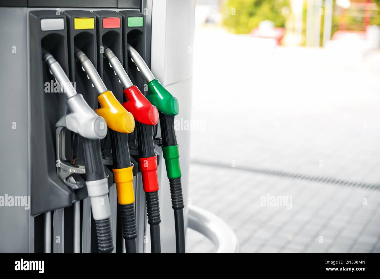 Fuel pump nozzles at modern gas station Stock Photo Alamy