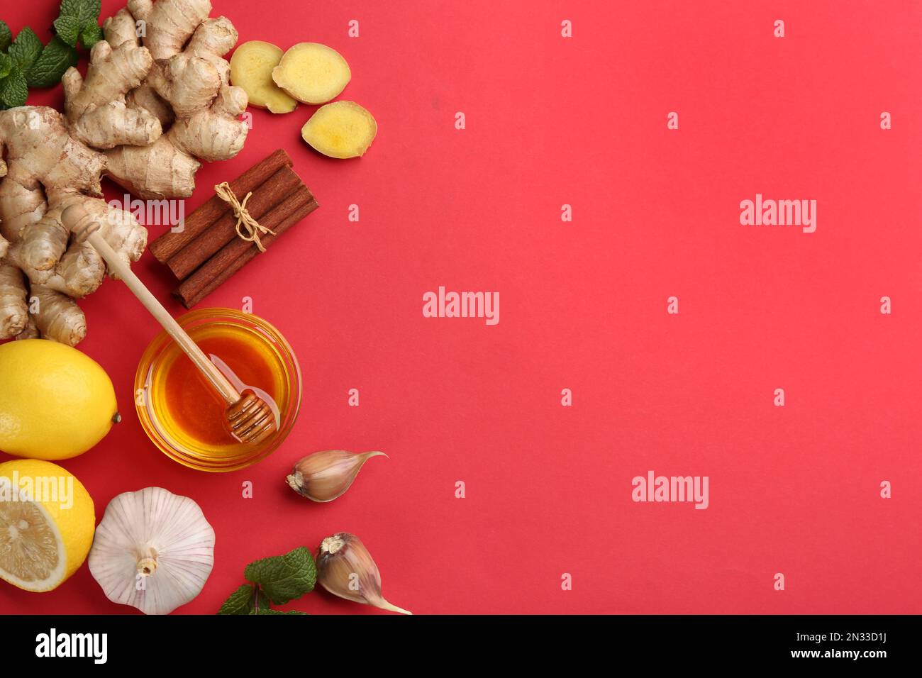 Flat lay composition with different natural antibiotics on red background, space for text Stock Photo