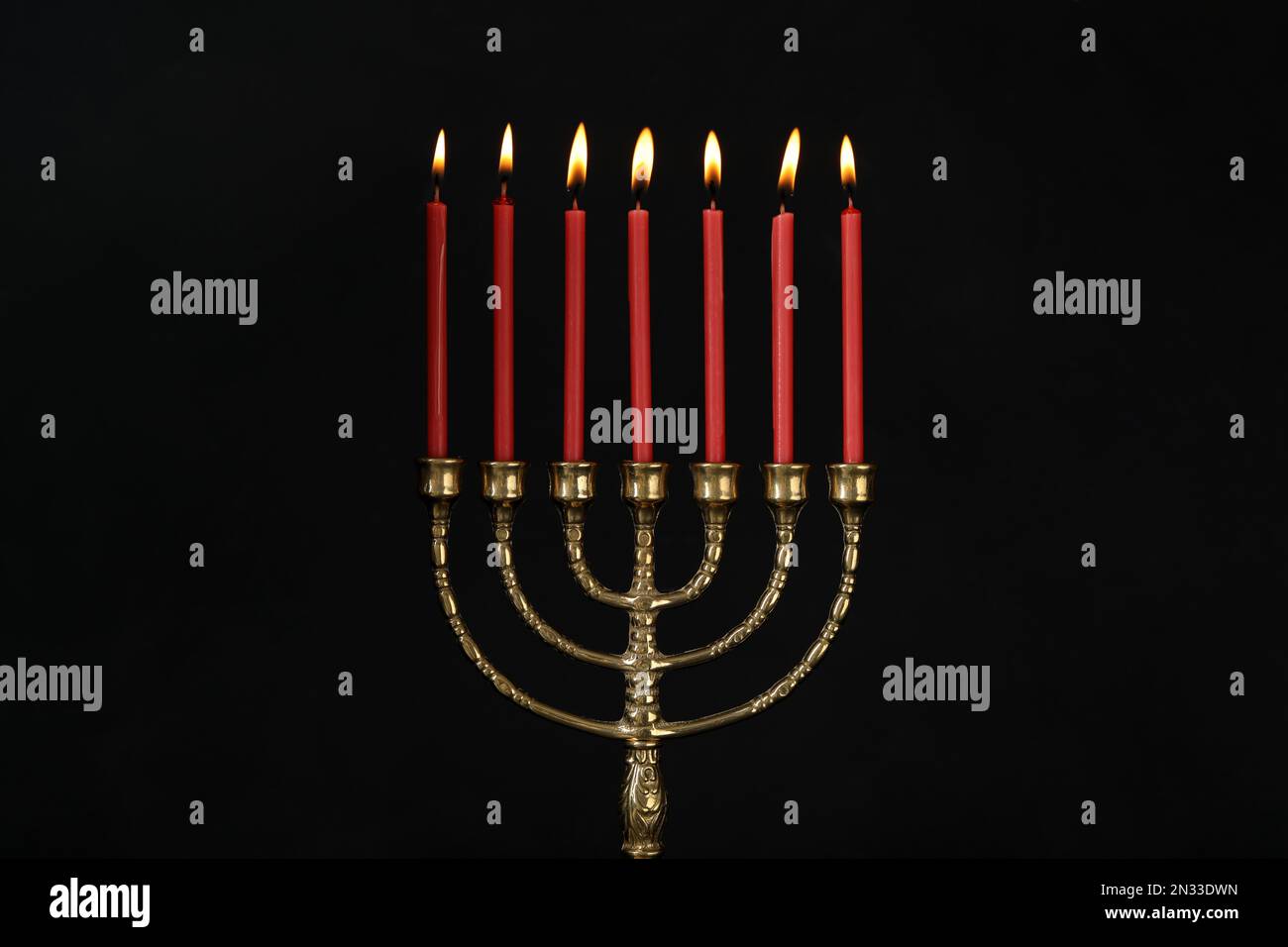 Golden menorah with burning candles on black background Stock Photo Alamy