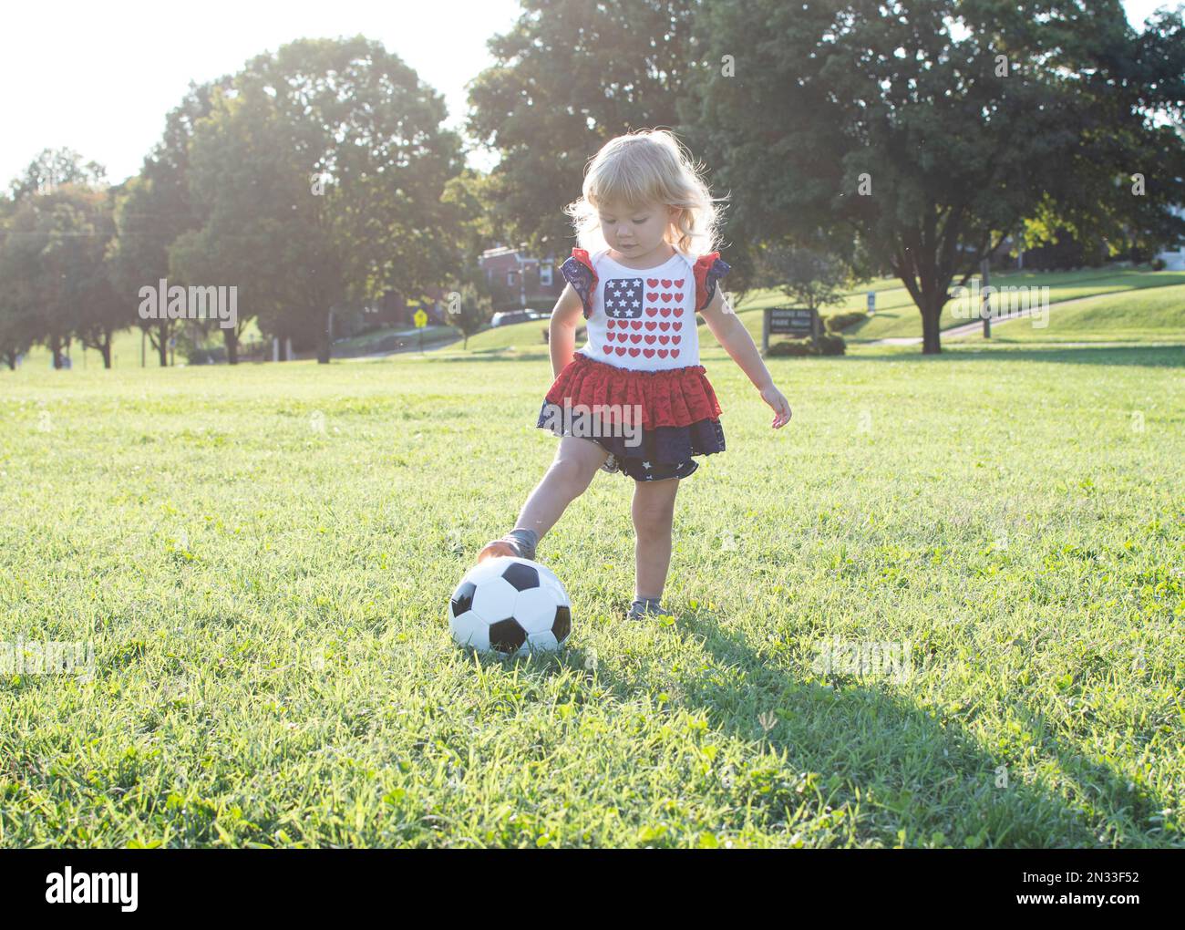 little child playing soccer. White caucasian toddler girl plays football Stock Photo Alamy