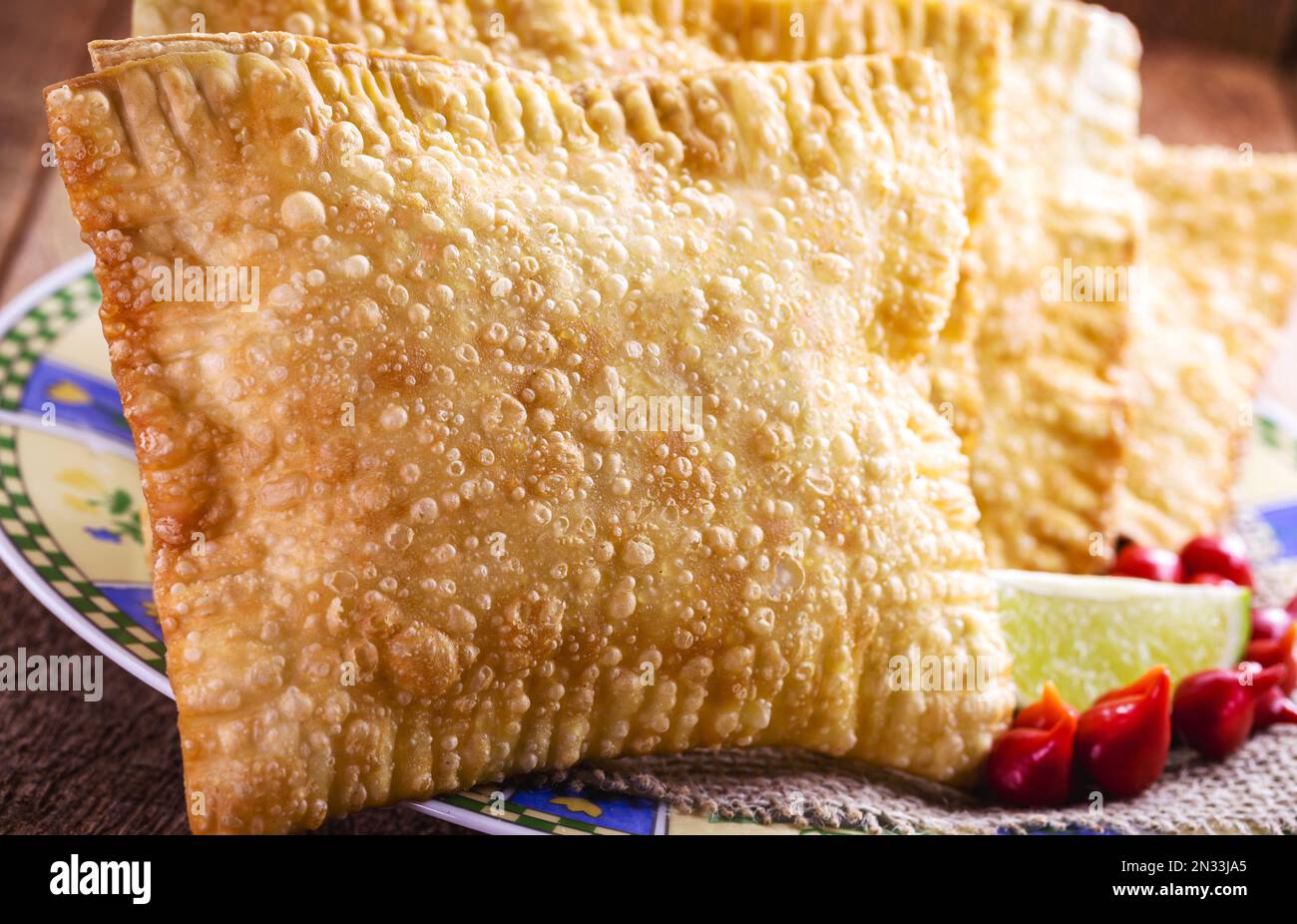 Brazilian pastry, traditional fried dough called pastel with lemon or