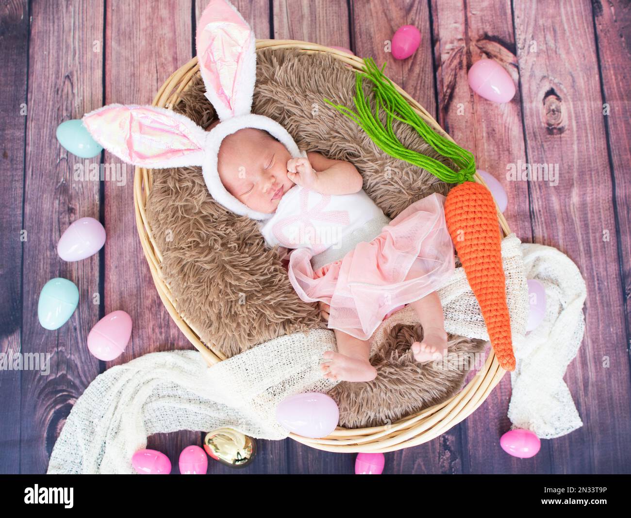 Sleeping, newborn baby. Easter bunny baby costume. Premature baby Stock