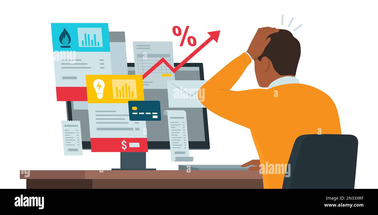 Man sitting at desk and checking expensive utility bills online on his