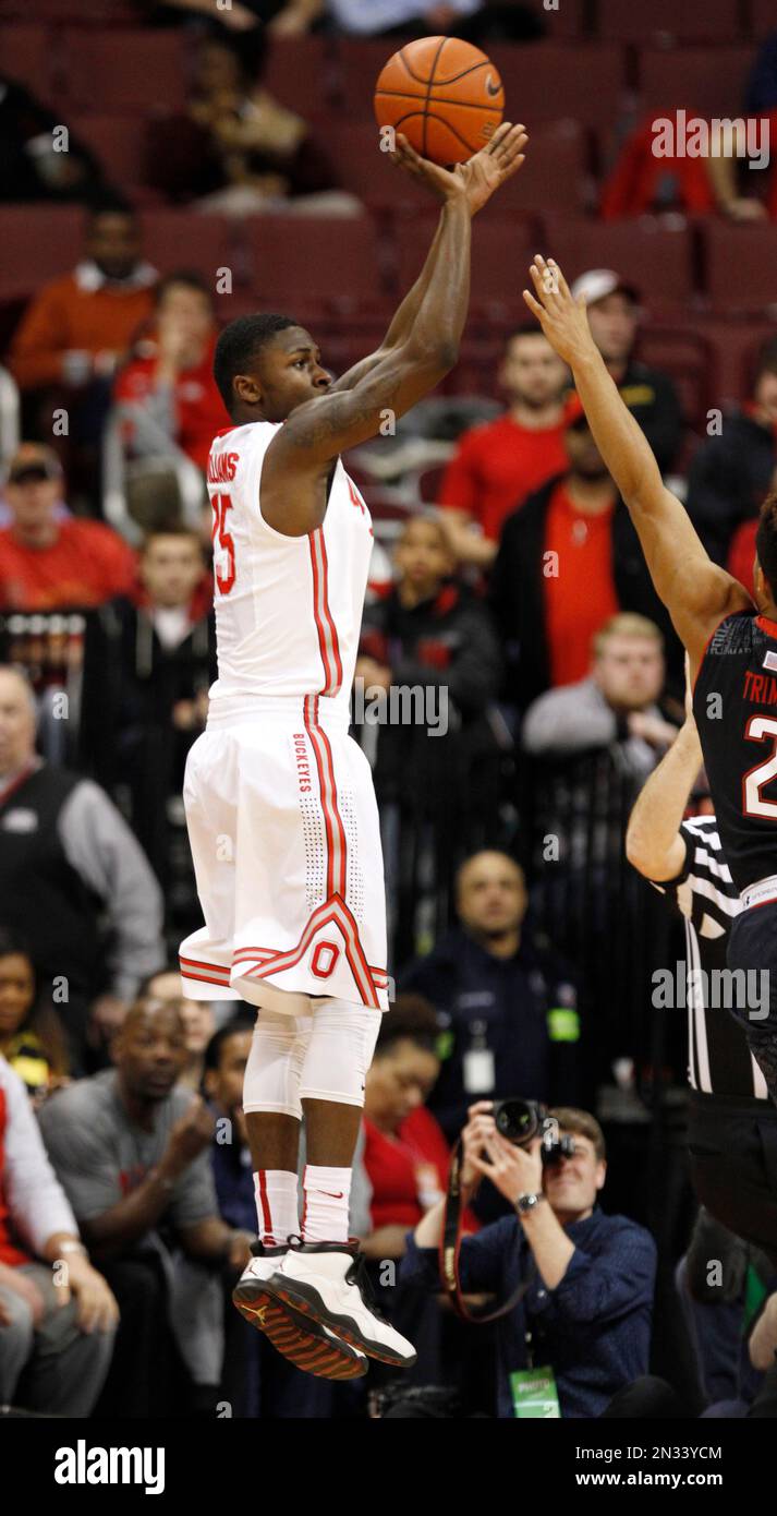 Ohio State's Kam Williams, left, goes up for a shot against Maryland's