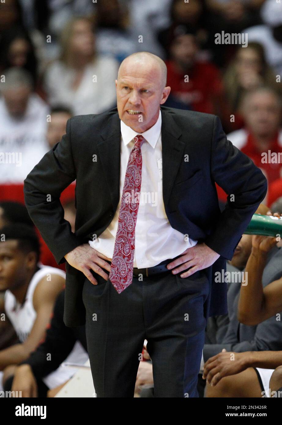 Cincinnati associate head coach Larry Davis coaches against UConn in
