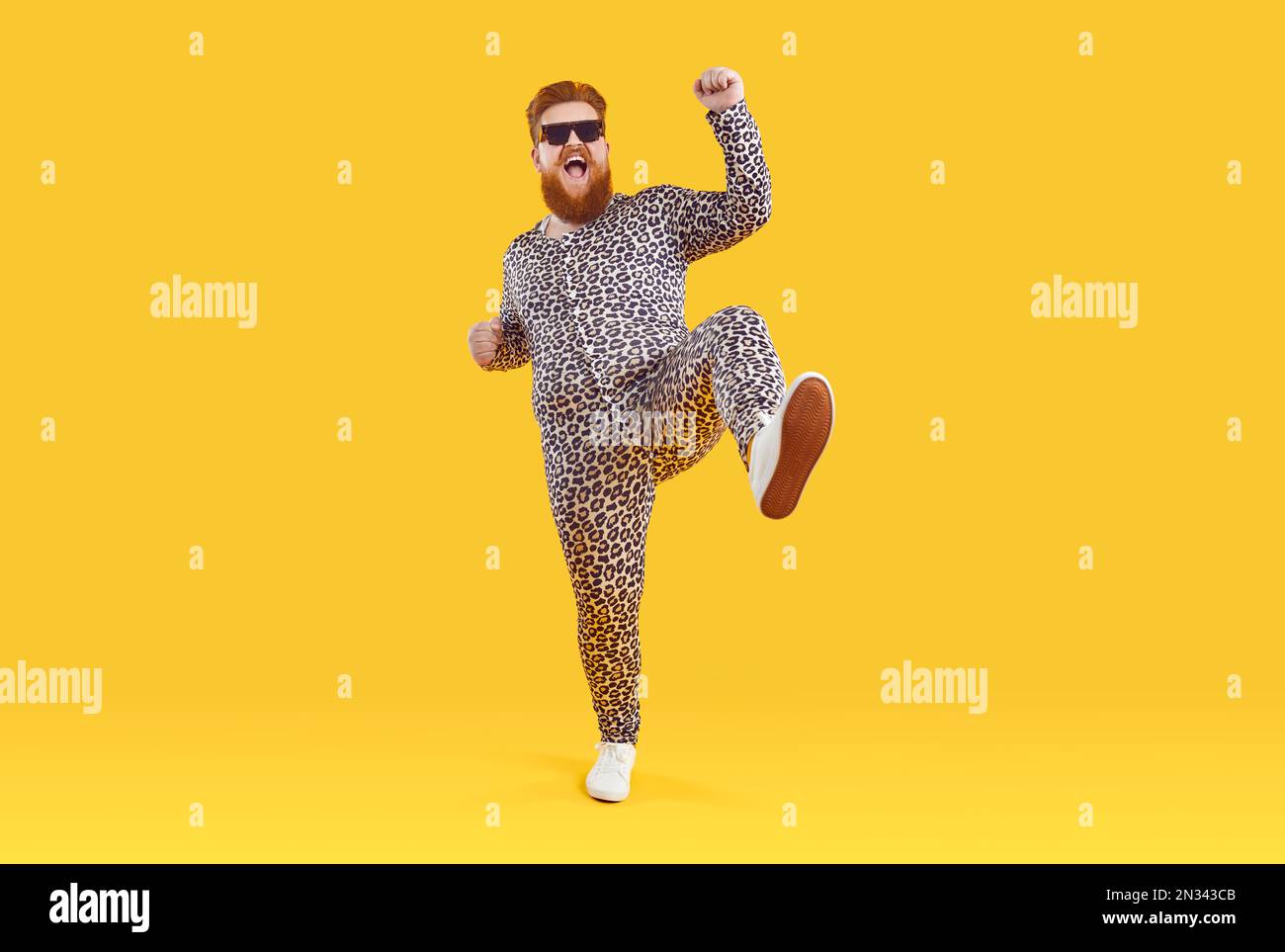 Funny happy plus size positive man in pajama suit with leopard print