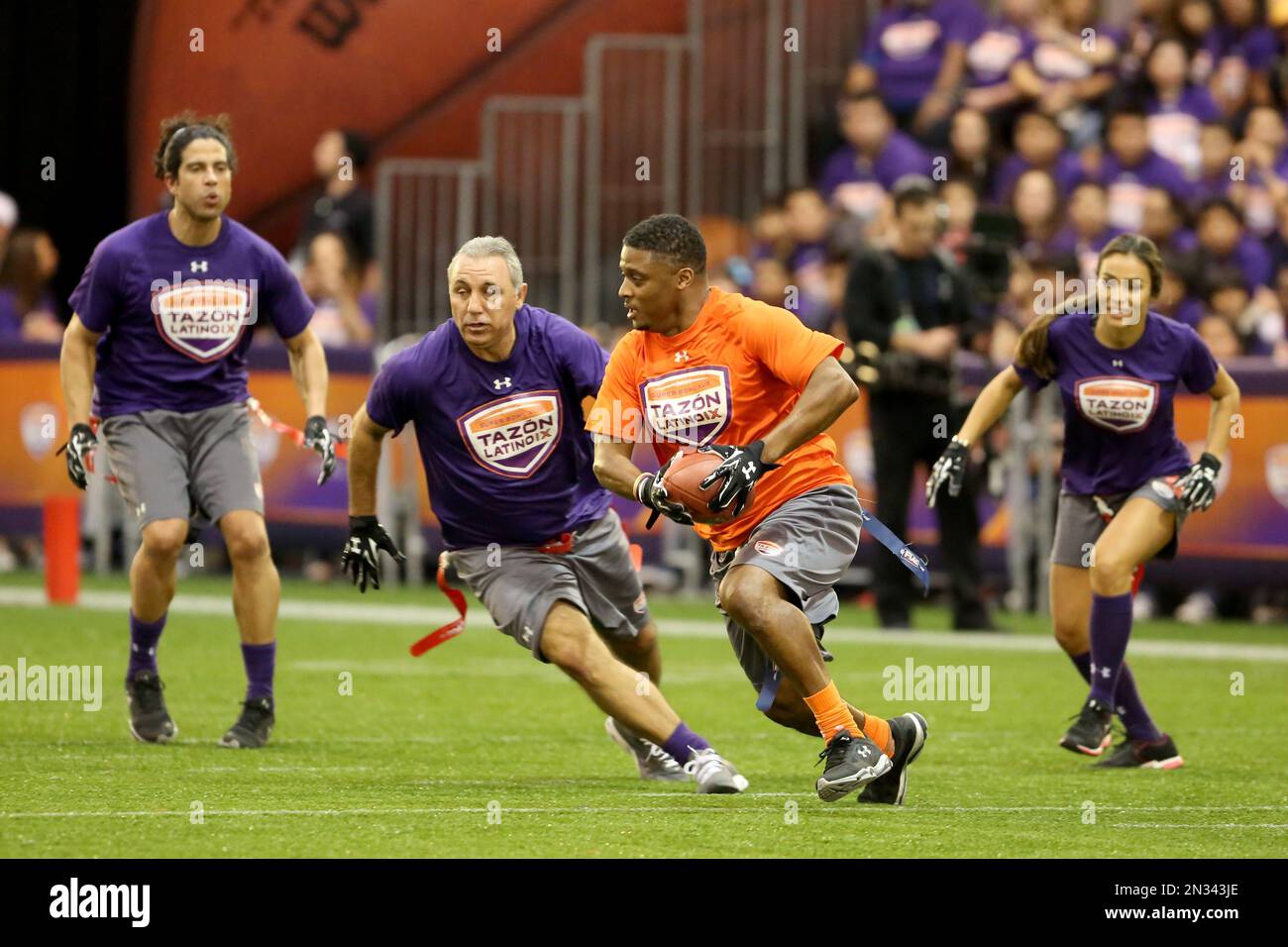 AFC Team's Warrick Dunn competes against the NFC Team in the Tazon