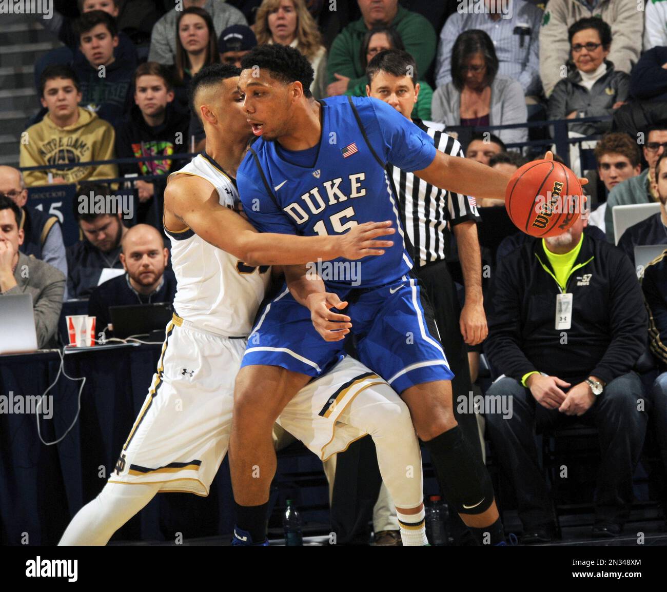 Duke center Jahil Okafor, right, drives the lane as Notre Dame forward