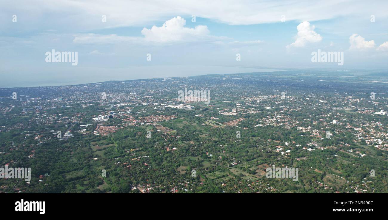 Managua city next to lake aerial drone view on sunny day Stock Photo