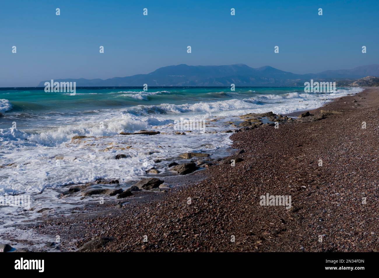 Landscape of an east shore of Rhodes Island in Greece with rocky beach and big waves Stock Photo