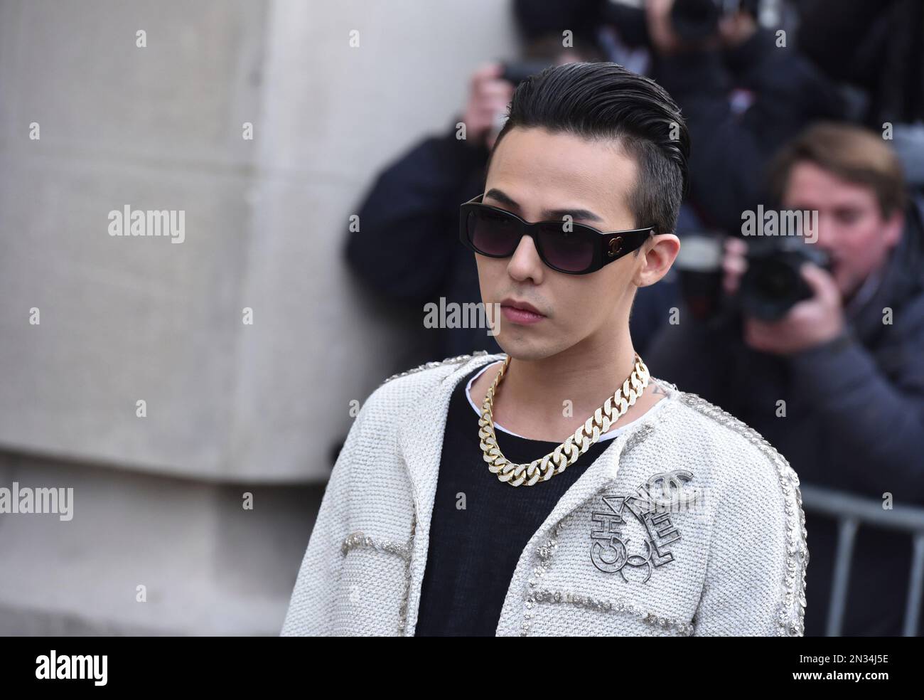 South Korean rapper Kwon Ji Yong, better known by his stage name G-Dragon,  leaves Chanel 's Spring-Summer 2015 Haute Couture fashion collection,  presented in Paris, France, Tuesday, Jan. 27, 2015. (AP Photo/Zacharie