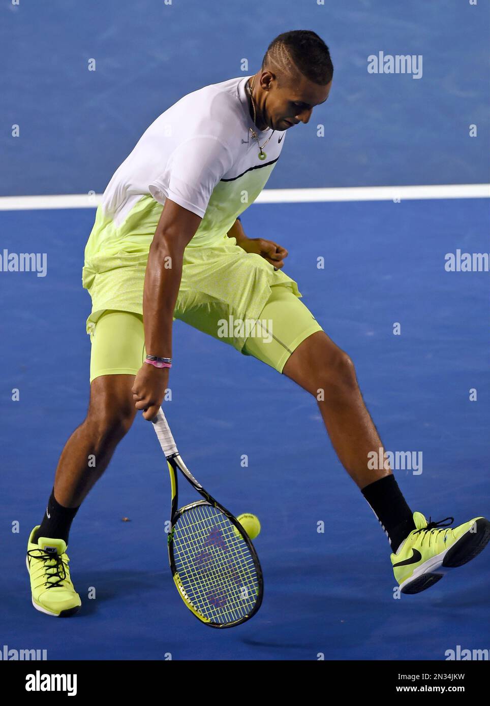 Nick Kyrgios of Australia plays a shot through legs as he plays Andy Murray of Britain during their quarterfinal match at the Australian Open tennis championship in Melbourne, Australia, Tuesday, Jan