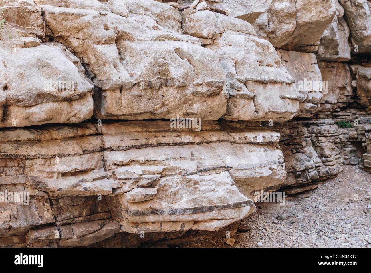 flint inside of limestone rocks in the bottom of Jacob's Canyon at Rhodes Island in Greece Stock Photo