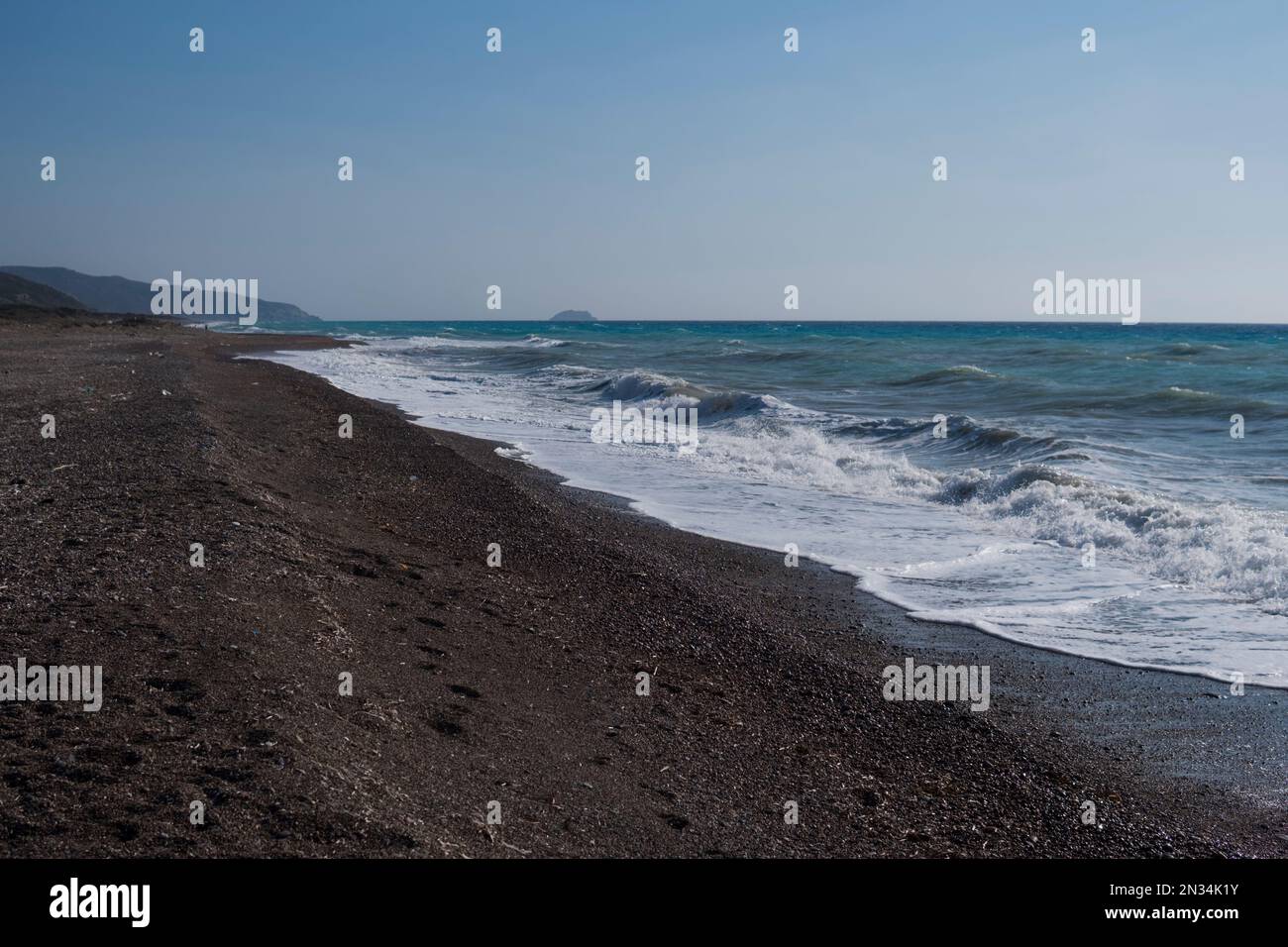 Landscape of an east shore of Rhodes Island in Greece with rocky beach and big waves Stock Photo