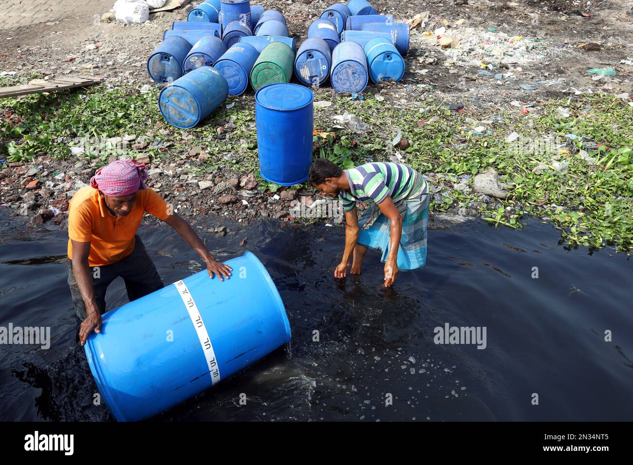 Dhaka, Dhaka, Bangladesh. 7th Feb, 2023. Workers are cleaning drums