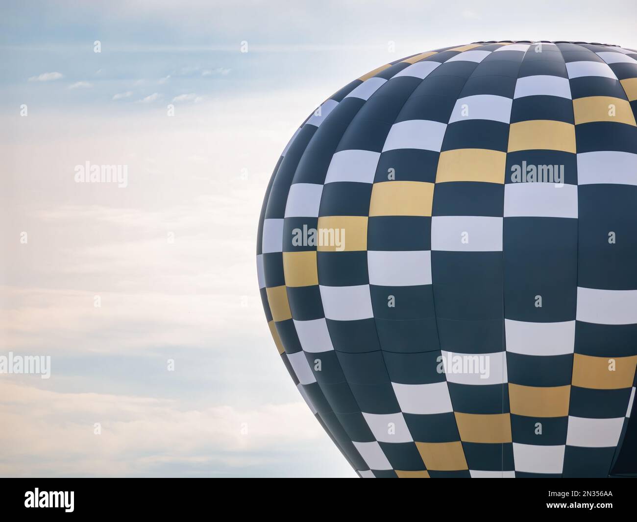 Hot air balloon flying against the bright blue sky Stock Photo - Alamy