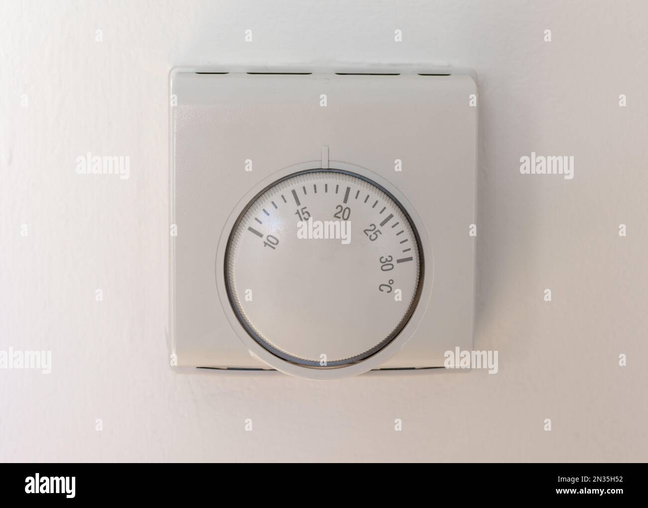 A thermostat dial in a home, heating and cost of energy concept Stock Photo Alamy