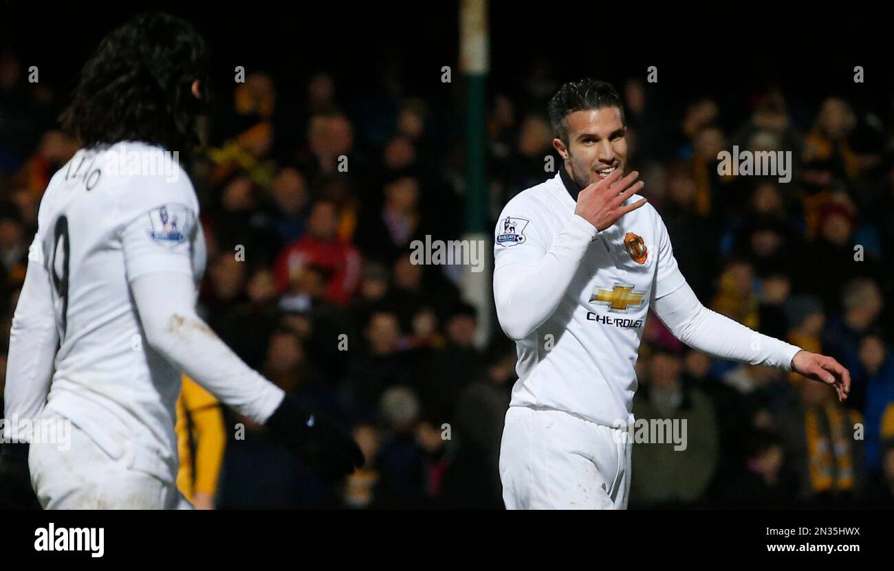 Manchester United's Robin Van Persie, right, looks back at teammate  Manchester United's Radamel Falcao after missing a chance on goal during  their English FA Cup fourth round soccer match between Cambridge United