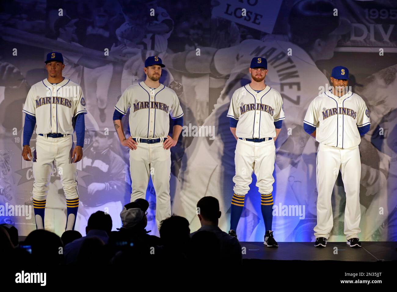 Seattle Mariners, from left, Taijuan Walker, James Paxton, Charlie Furbush  and Nelson Cruz show-off the team's new alternate Sunday uniforms during an  unveiling Friday, Jan. 23, 2015, in Seattle. The uniforms are