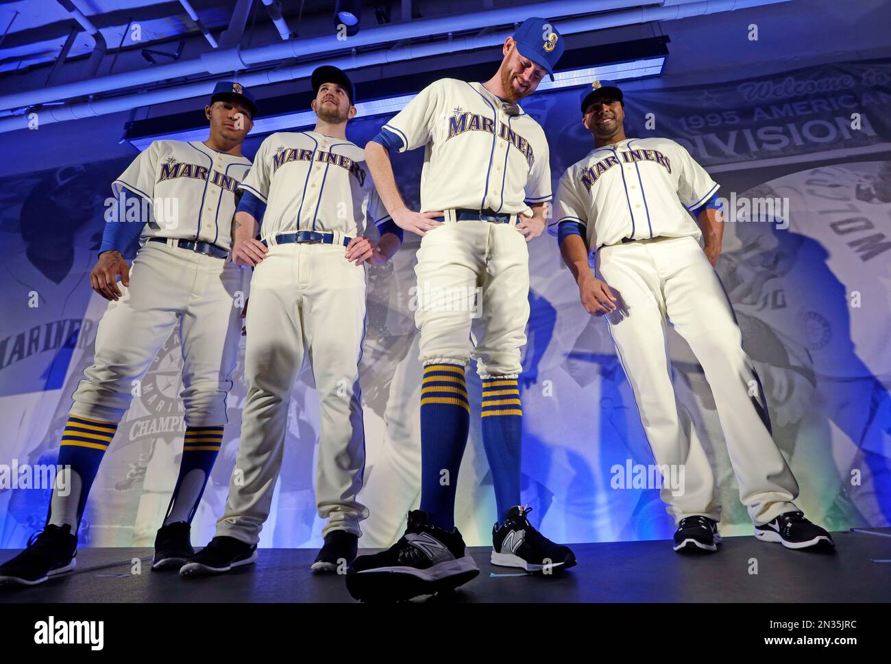 Seattle Mariners, from left, Taijuan Walker, James Paxton, Charlie Furbush  and Nelson Cruz show-off the team's new alternate Sunday uniforms during an  unveiling Friday, Jan. 23, 2015, in Seattle. The uniforms are